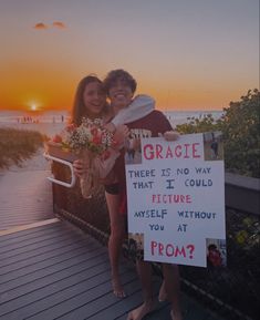 two people standing next to each other holding flowers and a sign that says gracie there is no way that i could picture yourself without my self without you at sunset