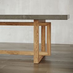 a wooden table sitting on top of a hard wood floor