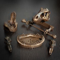 an assortment of bronze figurines on a table