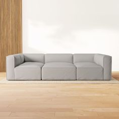 a couch sitting on top of a hard wood floor