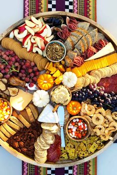 a platter filled with lots of different types of food and snacks on top of each other