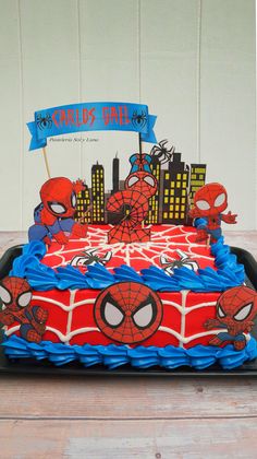 a spiderman birthday cake on a table