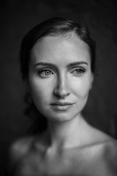 a black and white photo of a woman's face