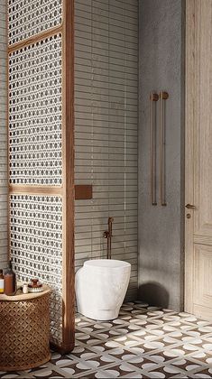 a bathroom with a white sink and tiled floor next to a wooden shower head in the corner