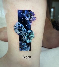 a woman's lower leg with flowers on it and the name sigak