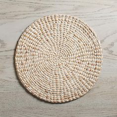 round woven hyacinth placemat with white-wash finish on a grey wooden background. Rattan Charger Plate, Rattan Charger, Outdoor Dinner Parties, Round Placemat, Dinner Table Setting, Outdoor Dinner, Holiday Tablescapes, Wall Basket, Food Storage Boxes