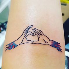 two hands making a heart shape with their fingers tattoo design on the left side of the arm