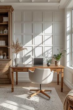 a home office with white walls and wooden furniture