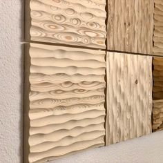 three panels of wood with different patterns on the sides and one panel is made out of plywood