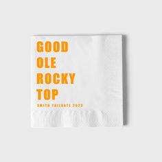 a napkin with the words good olee rocky top printed on it in orange and white