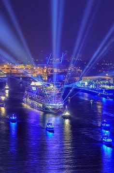 a large boat floating on top of a river at night