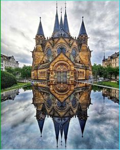 an image of a building that is reflecting in the water with its reflection on it's surface