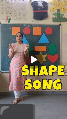 a woman standing in front of a blackboard with the words shape song on it