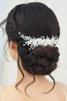 a woman wearing a bridal hair comb