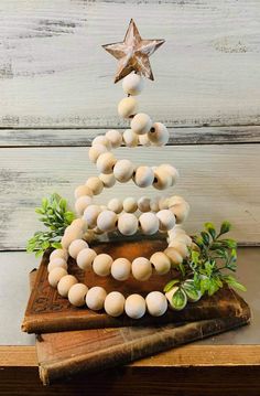 a christmas tree made out of eggs sitting on top of a wooden box with the words see