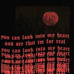 the words are written in red and black ink on a dark background with trees at night