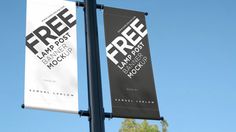 two free banners hanging from a lamp post