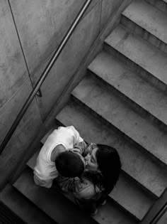 black and white photograph of a man on the stairs