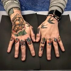 two hands with different tattoos on them