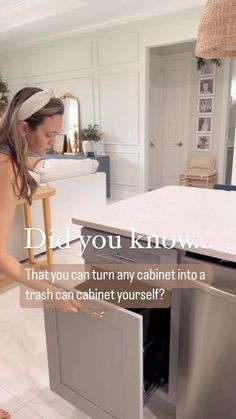 a woman standing in front of a dishwasher with the words did you know that you can turn any cabinet into a trash can cabinet?