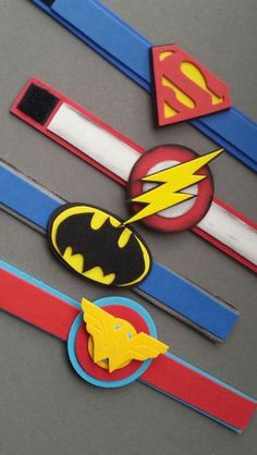 the batman and superman symbol are on top of each other's headbands