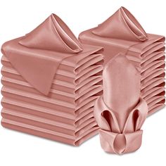 a stack of pink satin napkins sitting on top of each other