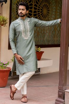 Featuring a sage green kurta in silk base with resham and thread hand embroidery. It is paired with cotton silk pants. Perfect wear for a festive occasion, wedding or sangeet ceremony.The biggest luxury blowout end of season sale up to 80% off captivating kurta sets. #Perniaspopupshopmen #menswear #ethnic #whatiworewastrending #ppuslove #kurtaset #silk #cottonsilk #threadwork #handembroidery #wedding #weddingwear #festivewear #traditional #sangeet #embroideredkurta Trending Kurta Colours For Men, Kurta Embroidery For Men, Green Suit Men, 480x800 Wallpaper, Embroidery Kurta, Sangeet Ceremony, Victorian Hallway