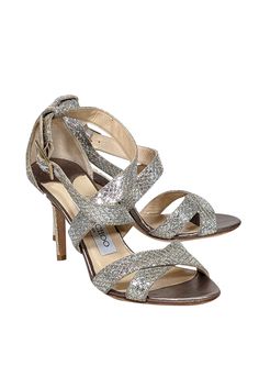 Sparkle and shine in these metallic Jimmy Choo strappy sandal heels! Featuring a glitzy design, they're the perfect match for any beaded cocktail dress or jazz up your skinny jeans with a touch of sparkle and a dazzling handbag! Size 6 (IT 36) Made in Italy Glitter-covered leather upper Strappy design with buckle closure Leather footbed Leather sole Heel 3.5" Beaded Cocktail Dress, Sandal Heels, Sparkle And Shine, Strappy Sandals Heels, Snakeskin Print, Jimmy Choo Shoes, Strappy Sandals, Silver Glitter, Snake Skin