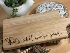 a wooden cutting board that says, what's what cheese said