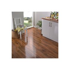 a chair sitting on top of a hard wood floor next to a kitchen countertop