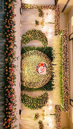 an aerial view of a flower display in the middle of a room with flowers all over it