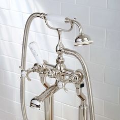 the faucet is attached to the wall in the bathtub, and it's water running from the faucet