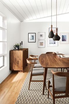 an iphone photo of a dining room table and chairs