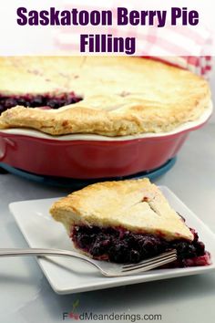 a slice of blueberry pie on a plate with a fork