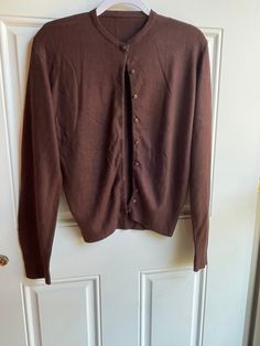 This authentic 1970's vintage brown cardigan sweater is in good condition with a little pilling. It is long sleeved with buttons up the front. Bust-36 inches Length-23 inches Sleeve-25 inches To see more of our vintage 1970's clothing inventory please visit our store at ChoiceRecycling.  We add new items every week. Thank you, Karmyn Classic Brown Sweater With Button Closure, Classic Brown Cardigan With Button Closure, Classic Brown Sweater With Buttons, Brown Buttoned Sweater For Winter, Fitted Brown Cardigan For Fall, Brown Button-up Cardigan, Vintage Long Sleeve Cardigan For Layering, Classic Fitted Brown Cardigan, Brown Buttoned Cardigan For Fall