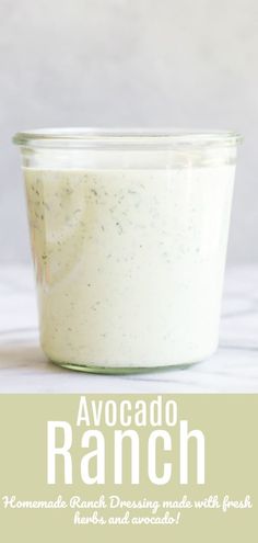 a jar filled with ranch dressing sitting on top of a table