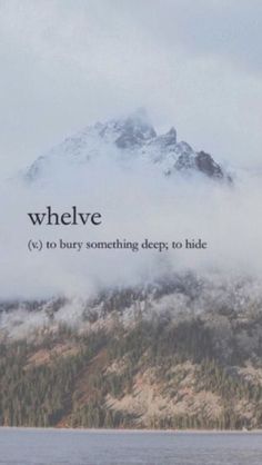 the words whelve are written in front of a mountain with trees on it