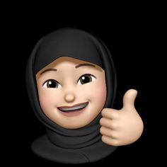 a woman wearing a black hijab giving the thumbs up