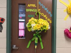 flowers are tied to the front door of a school