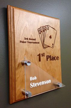 a wooden plaque with four playing cards and the words 1st place, bob stevens on it