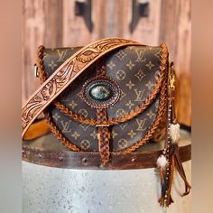 Customized Classic Boho Original Louis Vuitton Bag, This Bag Is Refurbished And Tooled By Professionals. Doesn’t Come With The Feather. Cute Western Purses, Louis Vuitton Western Purse, Western Louis Vuitton Handbags, Luxury Brown Hand Tooled Satchel, Luxury Brown Hand-tooled Satchel, Luxury Hand Tooled Brown Satchel, Luxury Hand-tooled Brown Satchel, Luxury Hand Tooled Satchel For Travel, Luxury Hand-tooled Satchel For Travel