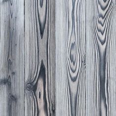 the wood grains are white and gray in color, as well as dark grey