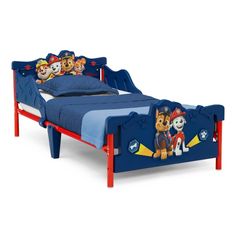 a child's bed with paw patrol bedspread