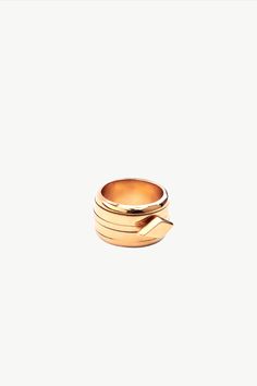 Our 24K gold-plated stress-relief ring is both charming and stylish. Inspired by the fidget ring, it features our signature diamond-shaped charm that glides around the band to soothe you during moments of stress and anxiety. Just give it a twirl to find relief. Made from recycled brass and plated in 24K gold or silver toned chrome. Dimensions:  Width of Band: 0.47in (12mm) Center Accent: 0.24in x 0.49in (6.2mm x 12.5mm) Stackable Necklaces, Spinning Ring, Spinning Rings, Stacked Earrings, Fidget Rings, Stackable Bracelets, Handcrafted Rings, Diamond Shaped, Chain Choker