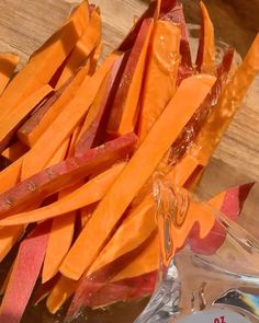 sliced up carrots sitting on top of a cutting board