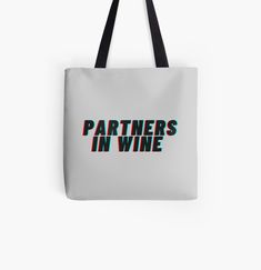 a white tote bag with the words partners in wine on it, against a white background