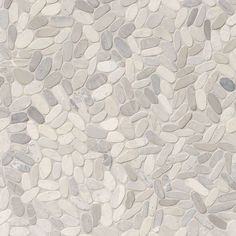 a white and grey stone floor with small rocks