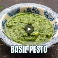 a bowl filled with pesto sitting on top of a table