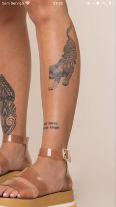 a woman's legs with tattoos on them