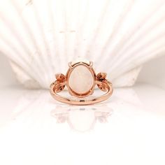 This chunky opal has all the colors of the rainbow, accented with natural earth-mined diamonds to make an overall gorgeous ring design set in 14k rose gold. This glowing opal ring is perfect for the modern bride or that special someone in your life! This opal ring also makes a beautiful October birthstone gift for your loved ones! Rose Gold Oval Opal Gemstone Ring, Oval Rose Gold Opal Gemstone Ring, Rose Gold Oval Opal Ring, Rose Gold Opal Gemstone Ring, Rose Gold Opal Ring In Fine Jewelry Style, Designer Silver Jewellery, Ethiopian Opal Ring, Colors Of The Rainbow, Gorgeous Ring